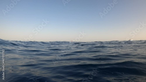 Underwater camera plunges over down into the water and into the depths of Egypt, the Red Sea. 4k video