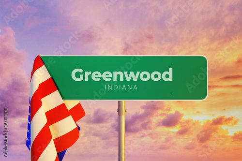 Greenwood - Indiana/USA. Road or City Sign. Flag of the united states. Sunset Sky. photo