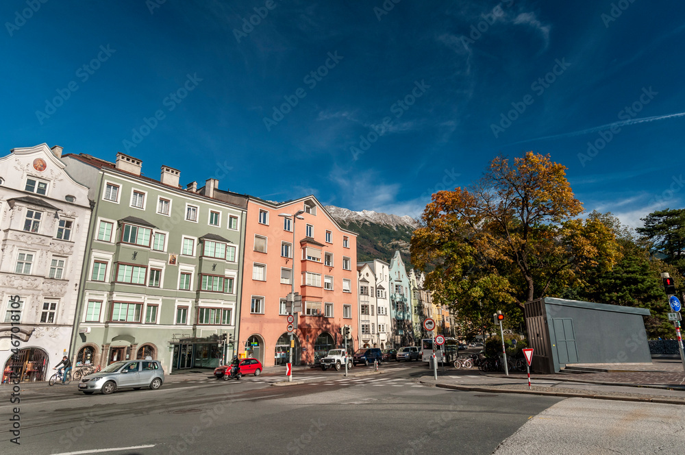 Innsbruck, Tyrol, Austria. Colorful houses and river inn on a sunny day with blue sky on october 18, 2021.