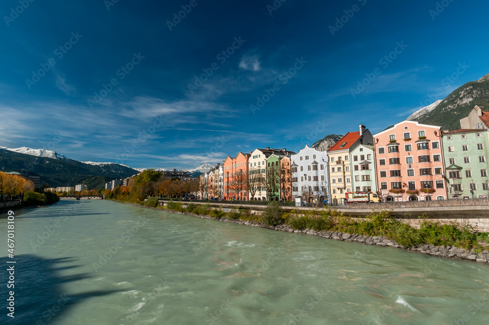 Innsbruck, Tyrol, Austria. Colorful houses and river inn on a sunny day with blue sky on october 18, 2021.