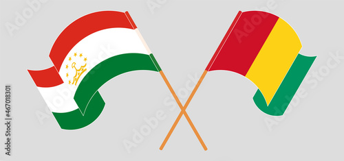 Crossed flags of Tajikistan and Guinea. Official colors. Correct proportion
