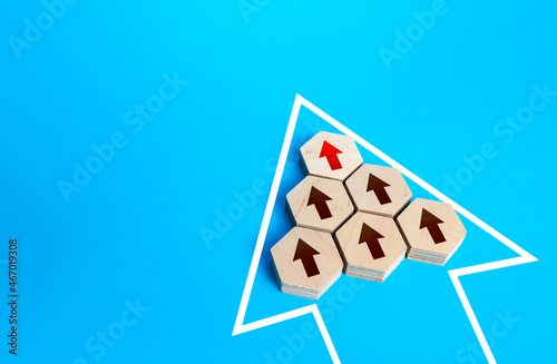 The unidirectional arrows are combined into a large arrow. Organizing into an effective team unit. Combining into organized group. Cooperation teamwork. Consolidation, strengthening. Common interest