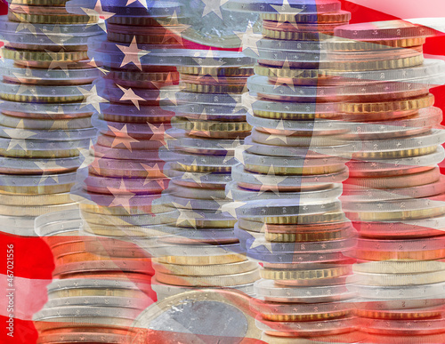 Fotografie Close up of a multiple exposure of some piles of dollar coins and a flag of the United States