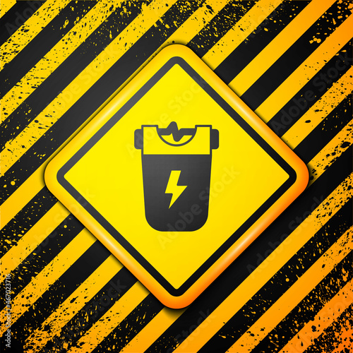 Black Police electric shocker icon isolated on yellow background. Shocker for protection. Taser is an electric weapon. Warning sign. Vector