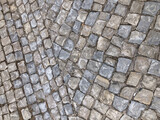High angle closeup of a stone Road paved texture