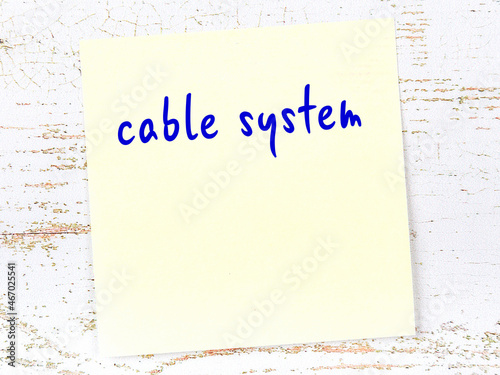 Yellow sheet of paper with word cable system. Reminder concept photo