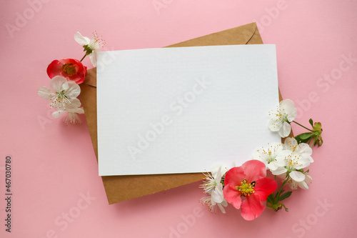 postcard mockup. Frame from flowering spring branches and white blank for the text. congratulation. invitation