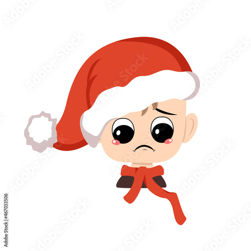 Boy with crying and tears emotion, sad face, depressive eyes in red Santa hat. Cute kid with melancholy expression in carnival costume for New Year, Christmas and holiday. Head of adorable child