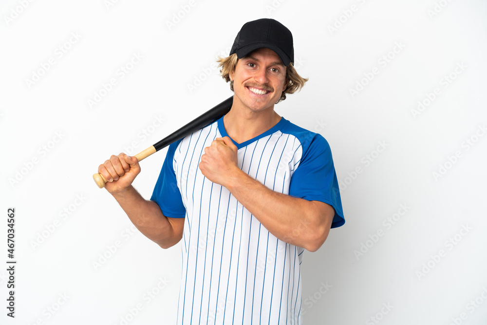 Young blonde man playing baseball isolated on white background celebrating a victory Young blonde man playing baseball isolated on white background celebrating a victory