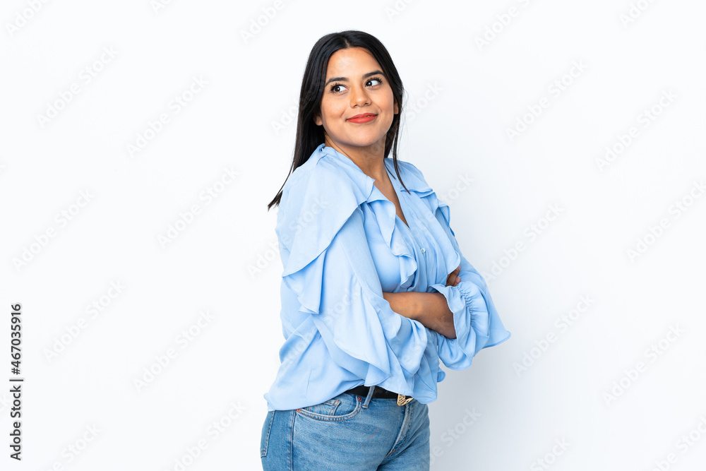 Young latin woman woman isolated on white background looking to the side and smiling Young latin woman woman isolated on white background looking to the side and smiling