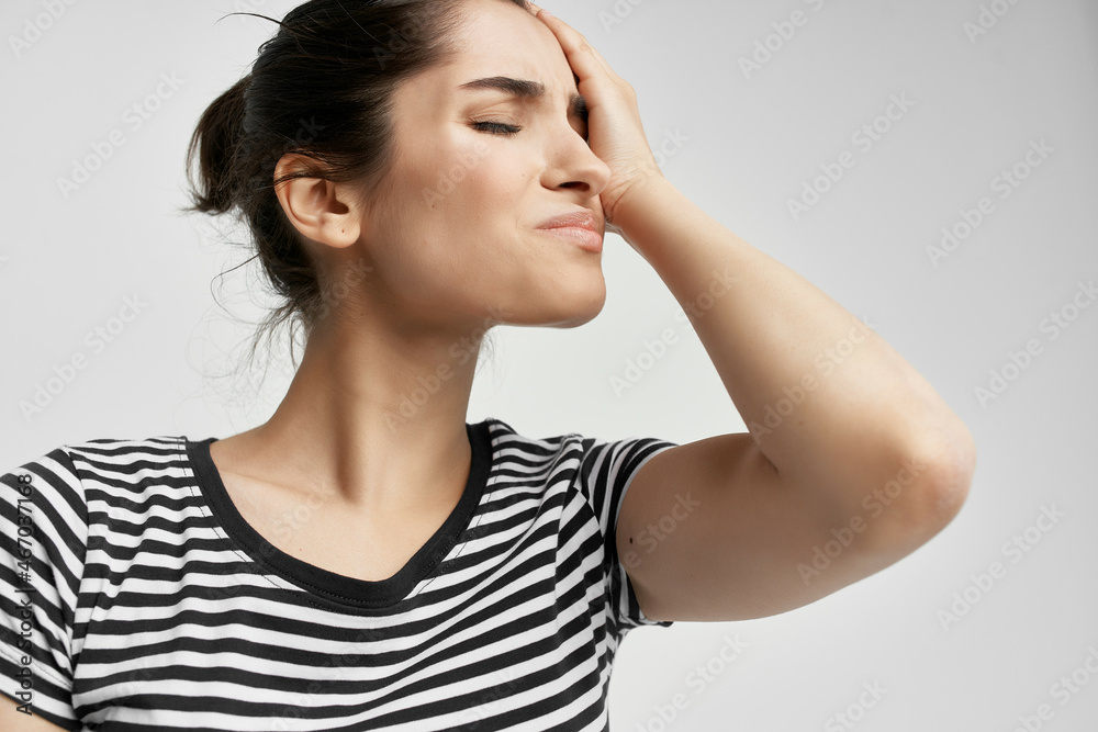 brunette holding his head migraine depression health problems