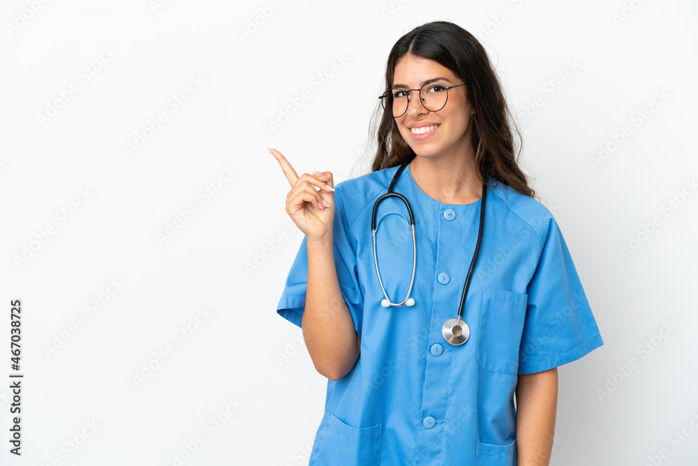 Young surgeon doctor caucasian woman isolated on white background pointing to the side to present a product Young surgeon doctor caucasian woman isolated on white background pointing to the side to present a product