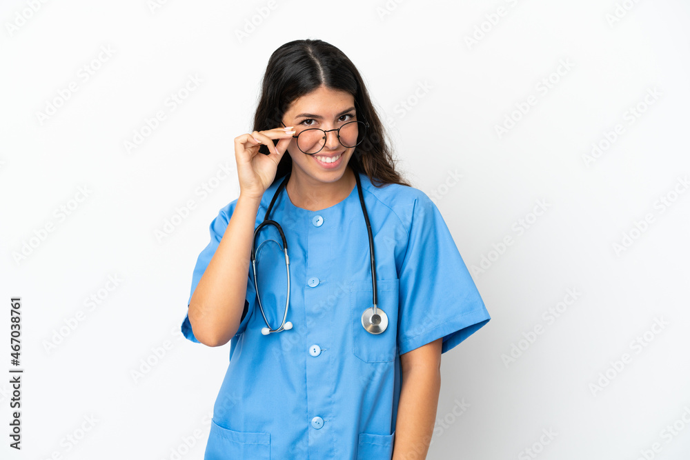 Young surgeon doctor caucasian woman isolated on white background with glasses and happy Young surgeon doctor caucasian woman isolated on white background with glasses and happy