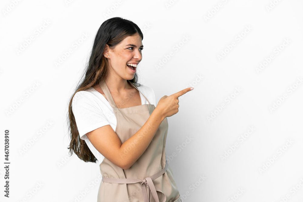 Restaurant waiter over isolated white background pointing finger to the side and presenting a product Restaurant waiter over isolated white background pointing finger to the side and presenting a product