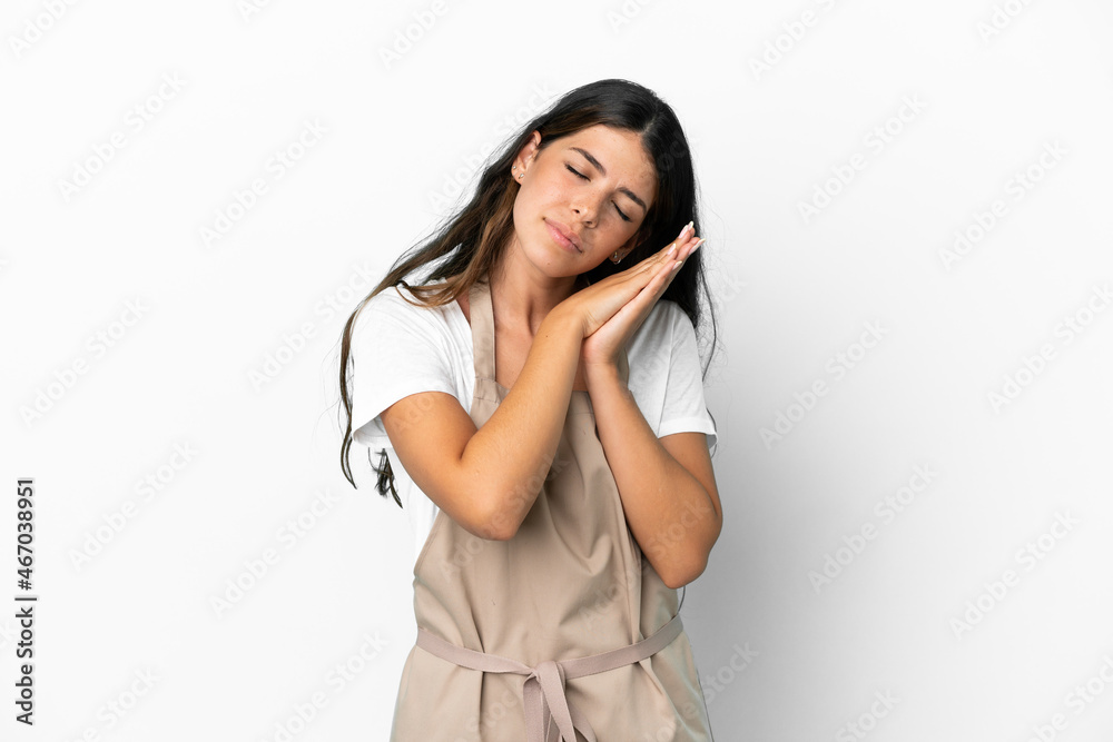 Restaurant waiter over isolated white background making sleep gesture in dorable expression Restaurant waiter over isolated white background making sleep gesture in dorable expression