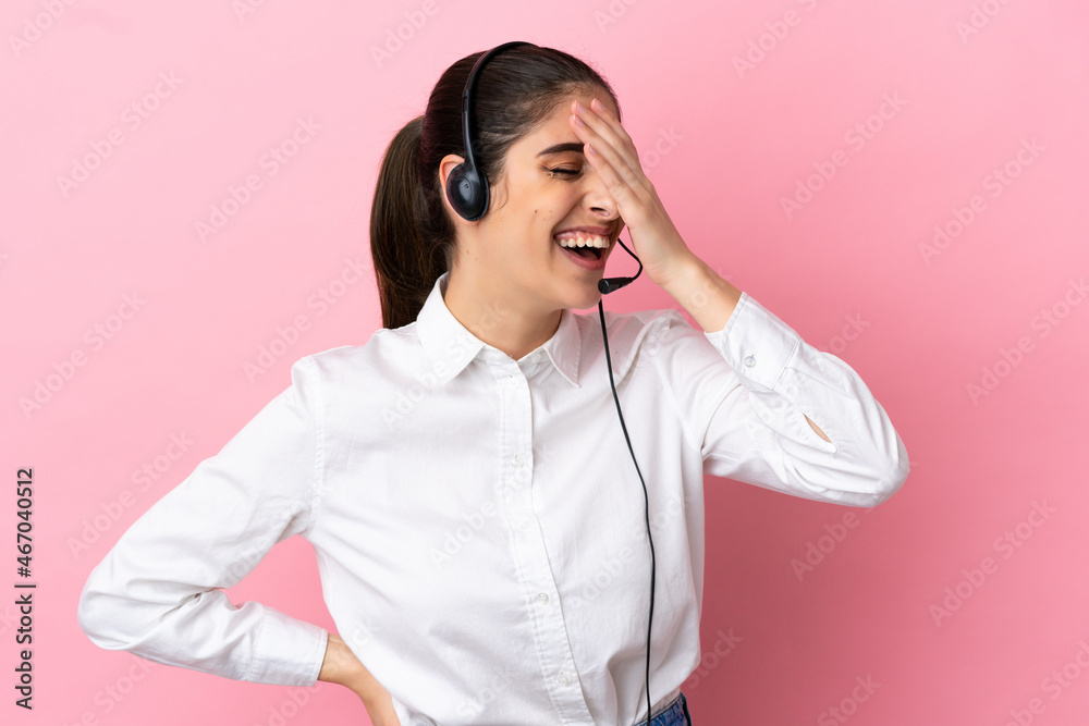 Young telemarketer over isolated background smiling a lot Young telemarketer over isolated background smiling a lot