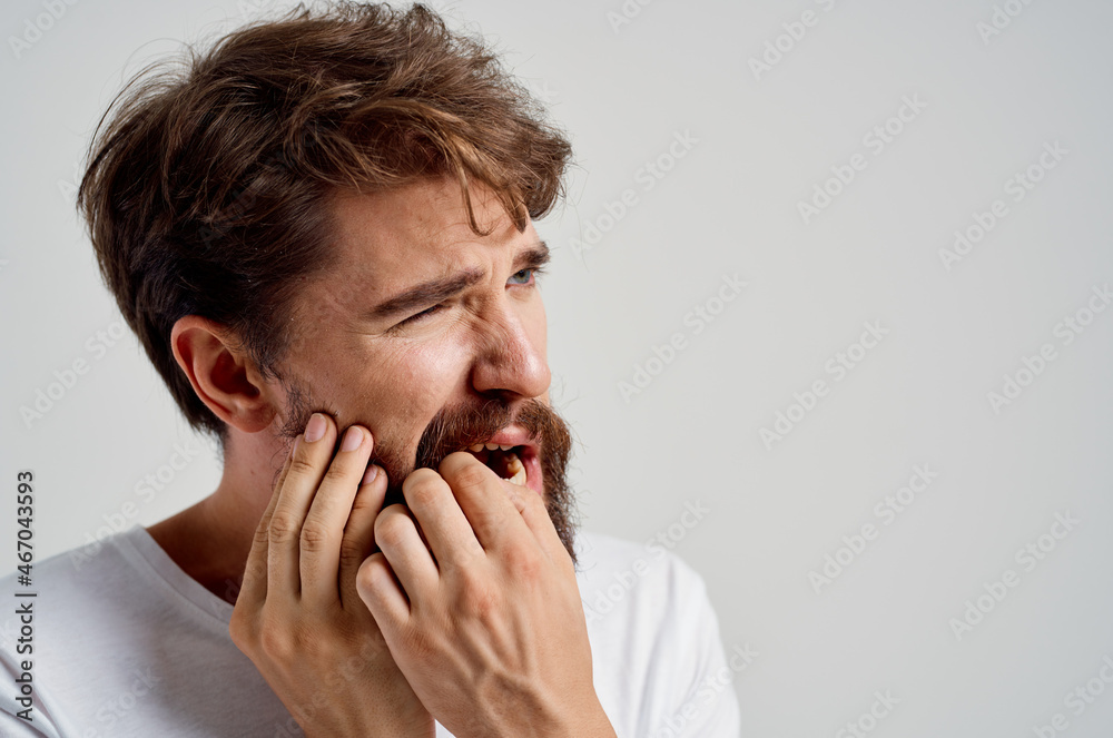 emotional man medicine toothache and health problems light background emotional man medicine toothache and health problems light background