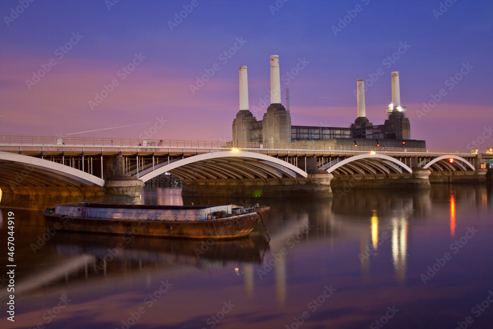 Night scene of the Thames river Battersea Power Station and rail brige