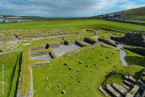 Viking longhouse ruins at the Jarlshof Prehistoric and Norse settlement in the Shetland Islands, Scotland, near the North Sea photo