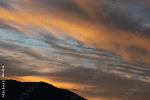 Moody clouds at sunrise over mountains