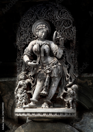 "Darpana Sundari" one of the 42 beautiful women sculptures from Chennakeshava Temple in Belur, Karnataka, India. It is famous for fine carvings in soap stones. 