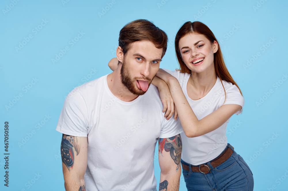 Fototapeta premium young couple white t-shirts fun tattoos for men