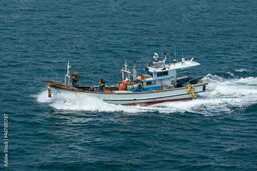 The fishing vessel moves to the sea. © Valerii