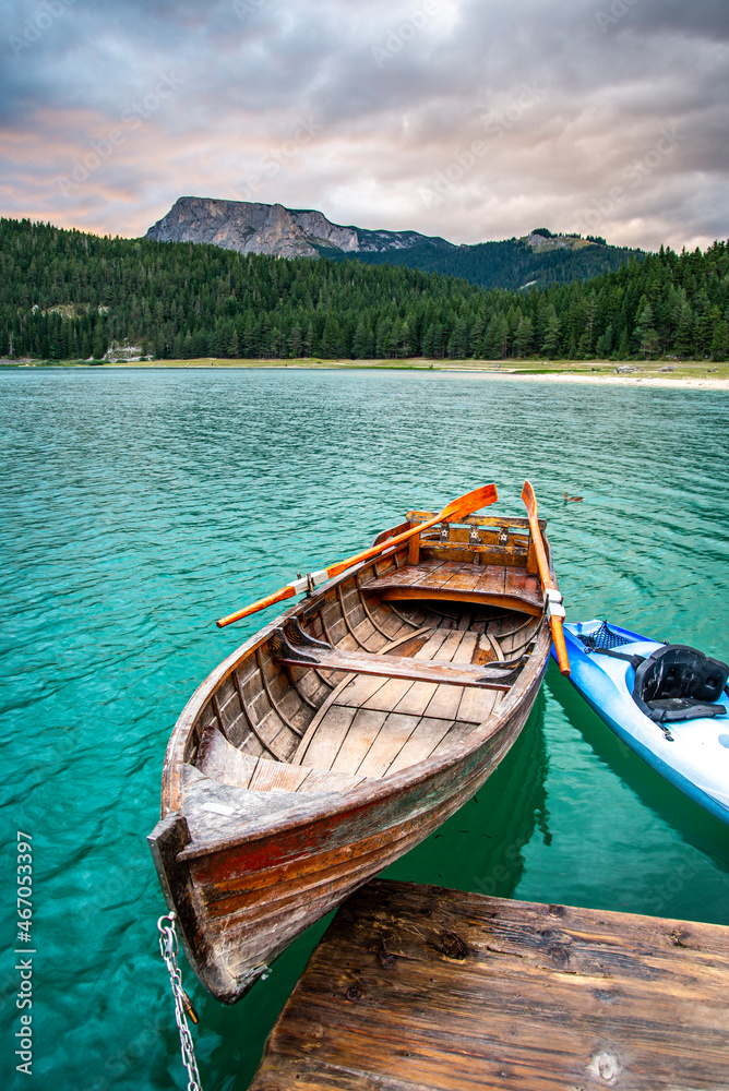 Canoes tied up at sunset,Black Lake ,Durmitor National Park,Montenegro,East Europe.