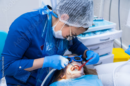 Fototapeta Naklejka Na Ścianę i Meble -  kid with oral dilator at dentist's appointment. treatment of teeth