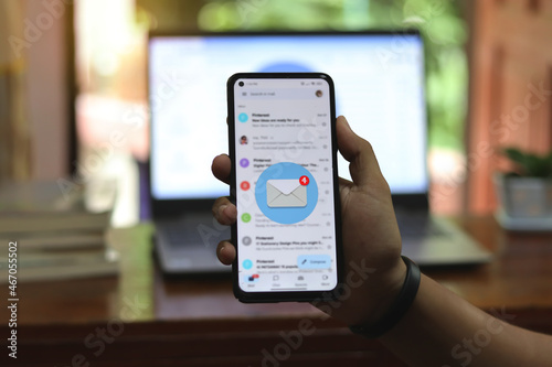 New email alert on laptop, communication connection message to global letters in the workplace.
