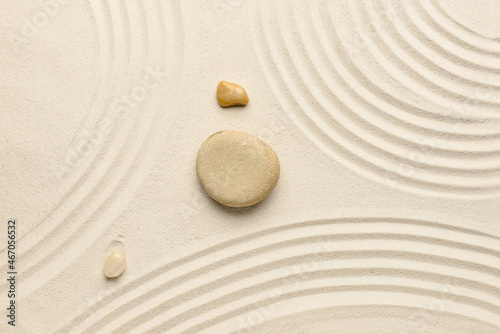 Spa stones on light sand. Zen concept