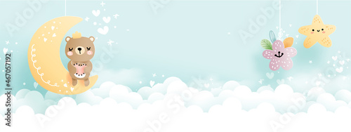 Teddy bear on half moon, blue sky 