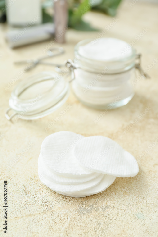 Clean cotton pads on light background, closeup