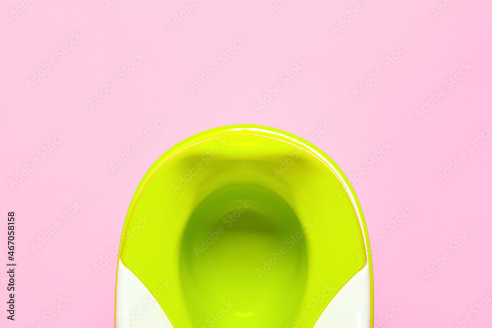 Green potty on color background, closeup Green potty on color background, closeup