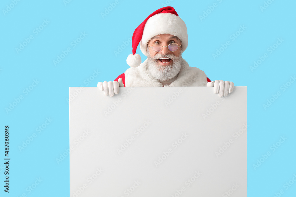 Santa Claus with blank poster on color background Santa Claus with blank poster on color background