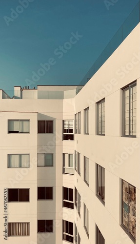 Modern white building with many windows