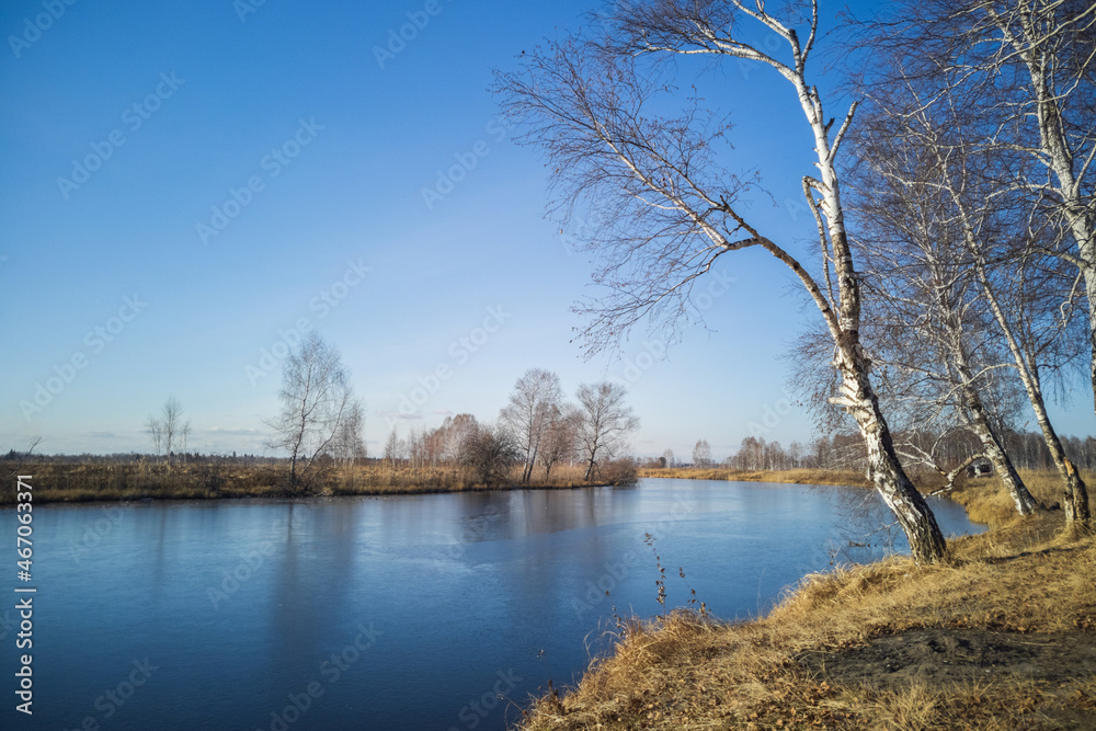 frozen river in October, autumn Siberian landscape
