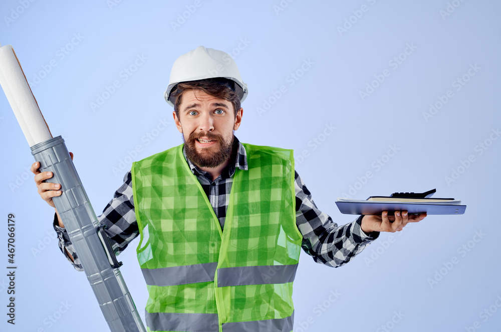 Obraz premium male worker in a white helmet blueprints Professional studio industry