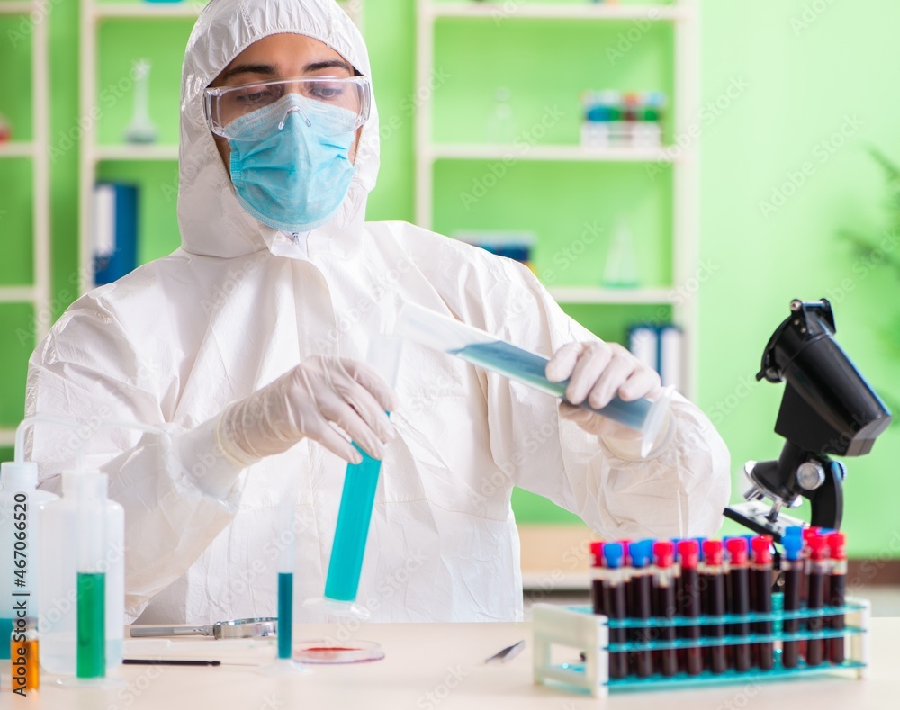 Chemist working in the lab on new experiment Chemist working in the lab on new experiment
