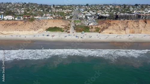 Drone shot flying towards Solana Beach and coastal city in San Diego, America photo