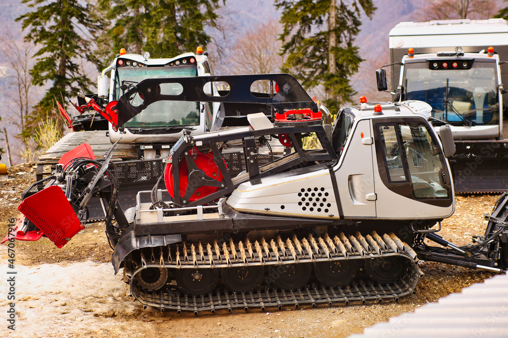 machine for snow preparation tractor on a mountainside, snow clearing and leveling 