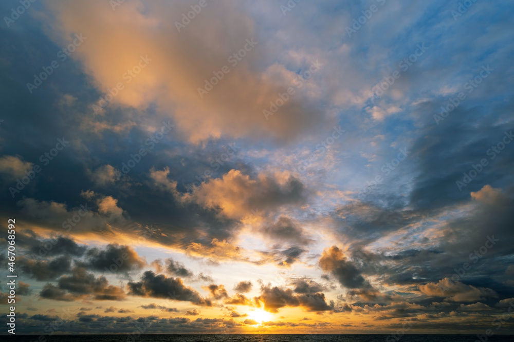 Dark clouds over sea at sunset Dramatic thunderstorm landscape with building clouds Natural rainy dark sky Amazing for nature composition background Dark clouds over sea at sunset Dramatic thunderstorm landscape with building clouds Natural rainy dark sky Amazing for nature composition background