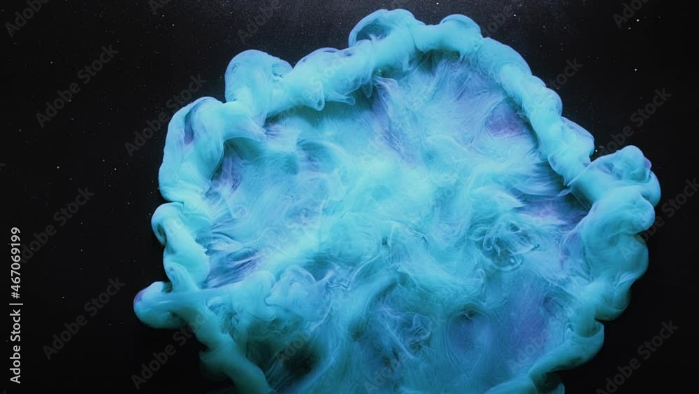 Ink water drop. Color explosion. Logo reveal effect. Fluid splash motion. Blue smoke cloud puff flow animation on black abstract art background with glitter dust particles.