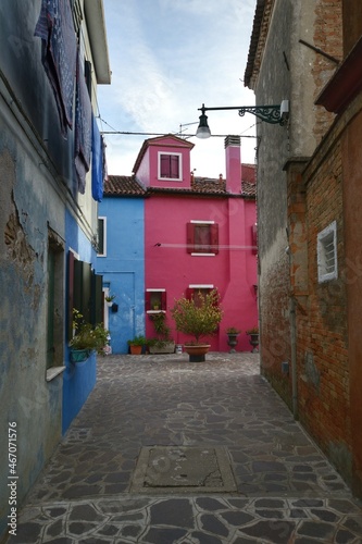 narrow street in the old town of Burano, Italy