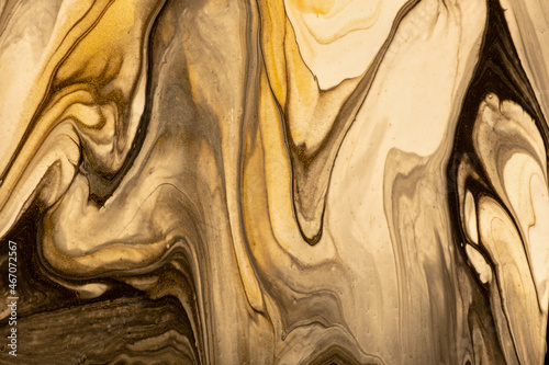 Abstract fluid art background brown and beige colors. Liquid marble. Acrylic painting with golden gradient and splash
