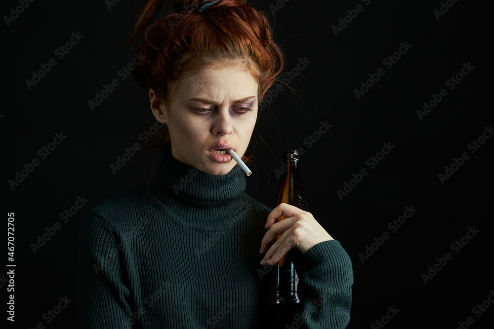 Obraz premium woman with bottle of alcohol bruises under eyes changes depression dark background