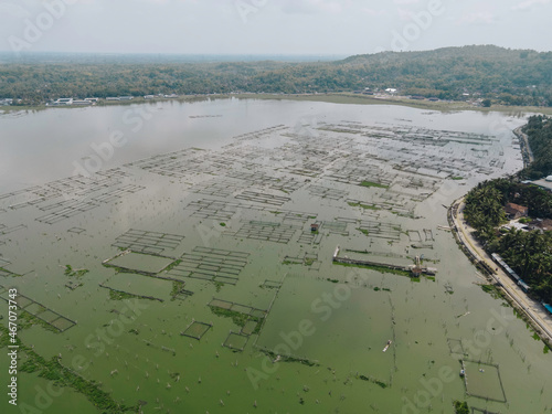 Aerial view of traditional floating fish pond on swamp in Indonesia photo