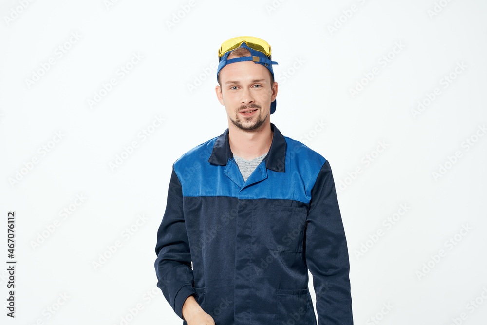Man in working form instruments Professional isolated background