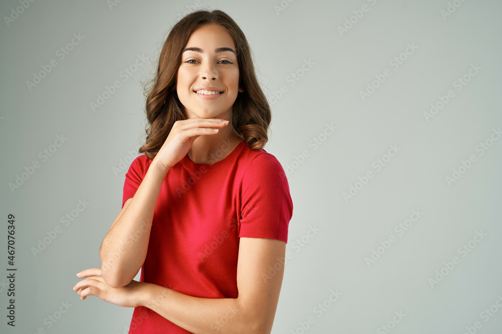 cheerful woman holding on to hair cosmetics light background cheerful woman holding on to hair cosmetics light background