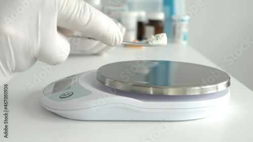 Doctor in a Laboratory, Weighing Medicines Using an Electronic Scale. Pharmacist Preparing a Medicament.